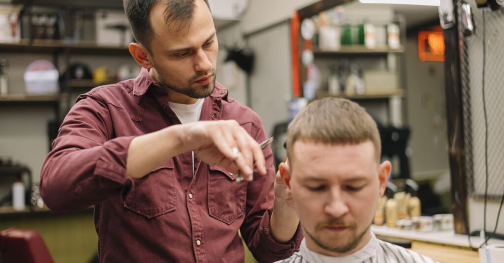 Butch cut with hard line disconnection and high skin fade for a sharp look