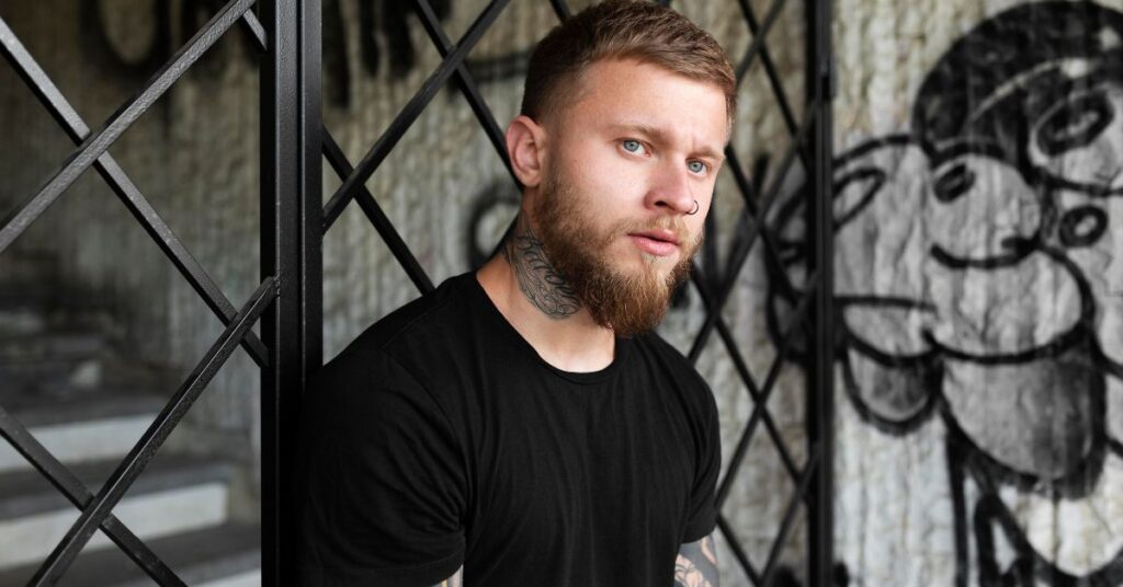 Classic layered undercut for men with high-contrast textured top and faded sides