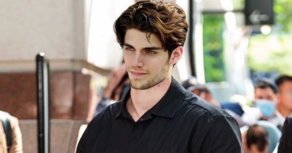 Classic scissor taper slick back hairstyle for men with neat, textured layers