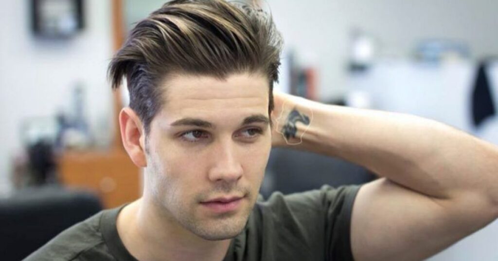 Disconnected undercut slick back hairstyle for men with sharp contrast and clean sides