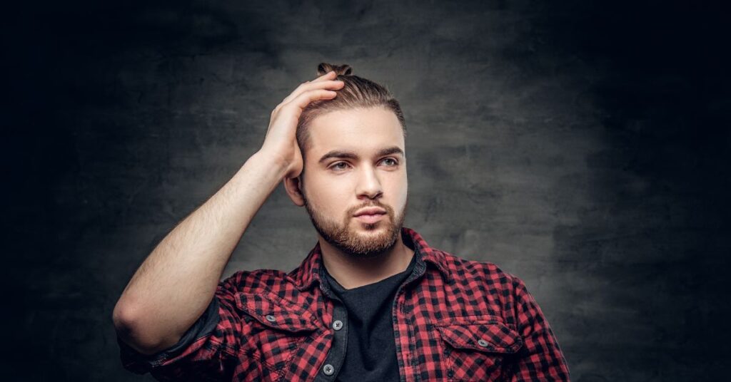 High fade haircut with messy textured top for men