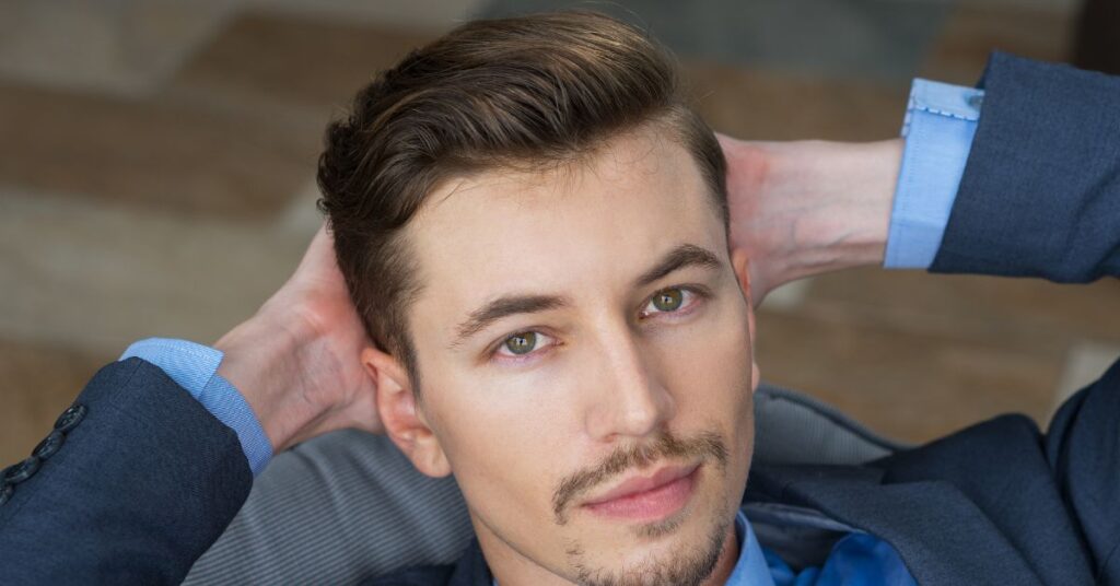 Layered executive cut with a classic taper fade and textured side-swept top