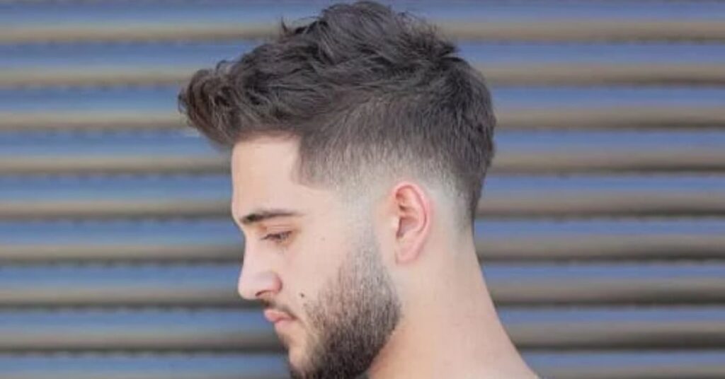 Long layered crew cut for men with a high taper fade and textured top.