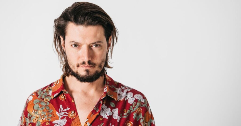 Messy Caesar cut with blunt fringe and textured top for men