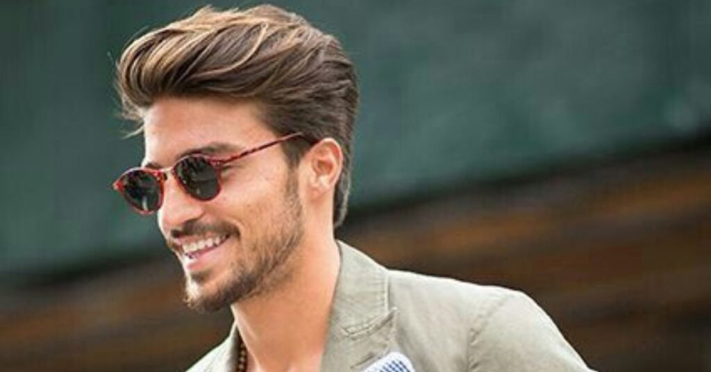 Messy comb over fade hair mens with textured top and high skin fade