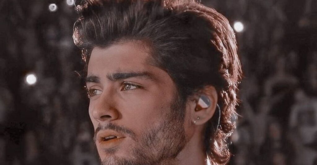 Razor-parted slick back hairstyle for men with precise, sharp part and clean sides