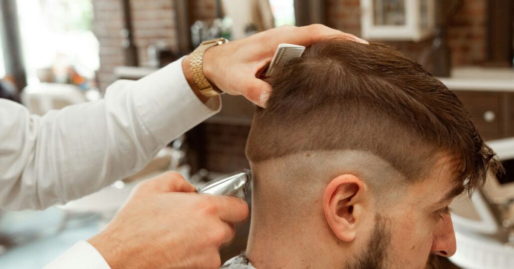 Side-swept Ivy League - medium length hairstyles for men