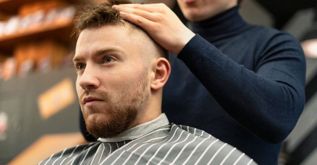 Soft taper fade for men with subtle layering and professional textured finish