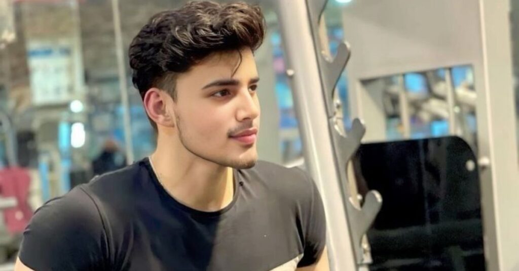 Temple fade slick back hairstyle for men with clean sides and classic finish