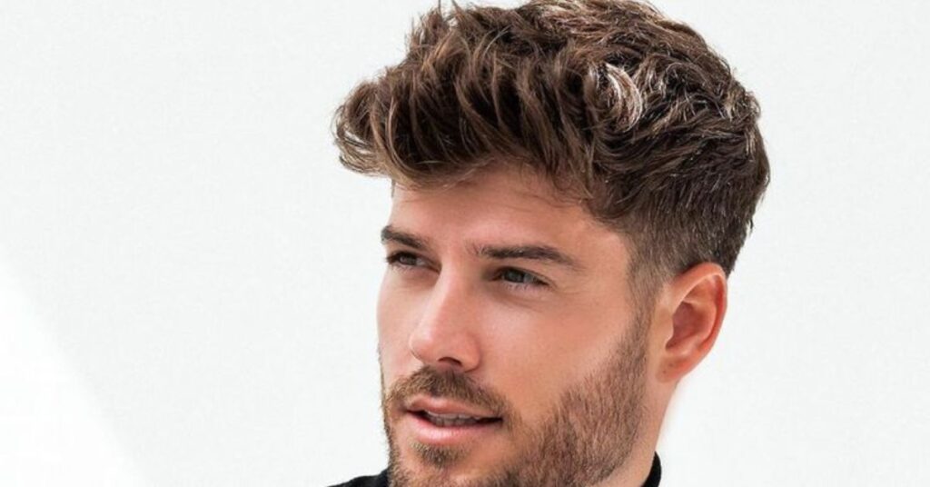 Textured slick back hair mens with messy controlled chaos look