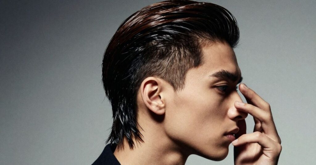  Textured slick back mullet hairstyle for men with layered volume