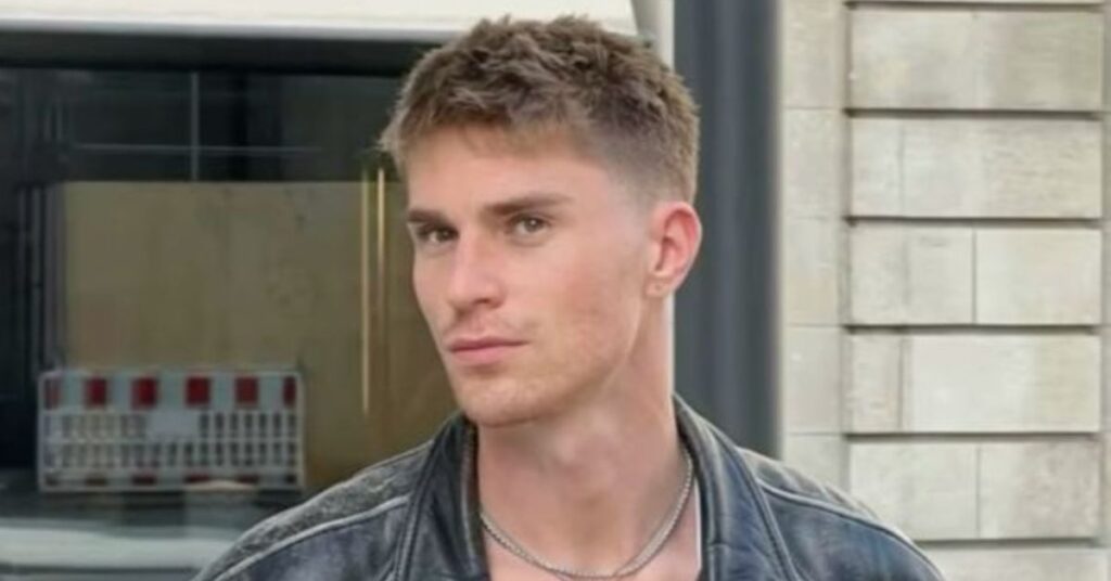 Classic men's crew cut hairstyle with short faded sides and slightly longer hair on top.