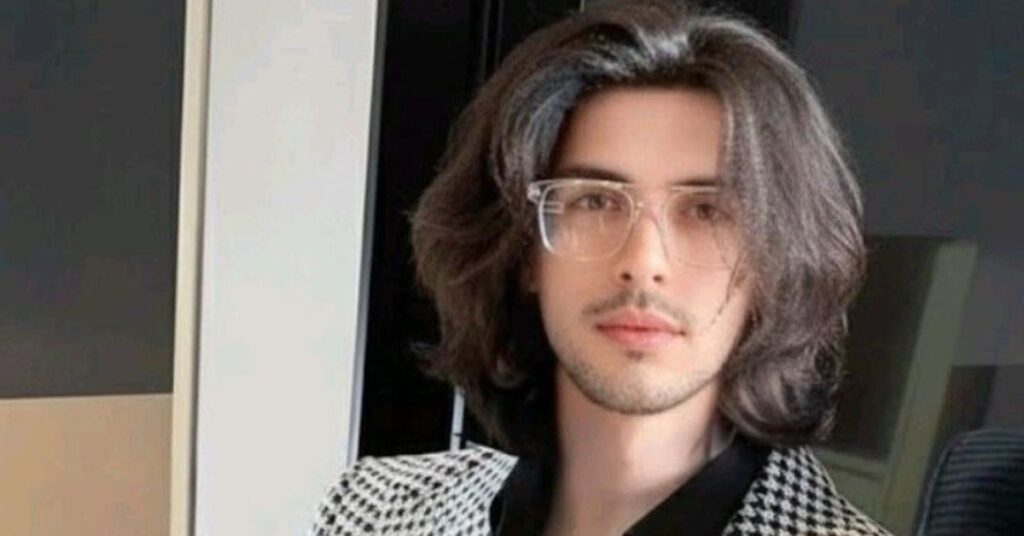 Unique man bob haircut with shoulder-length layers and soft natural texture for men.