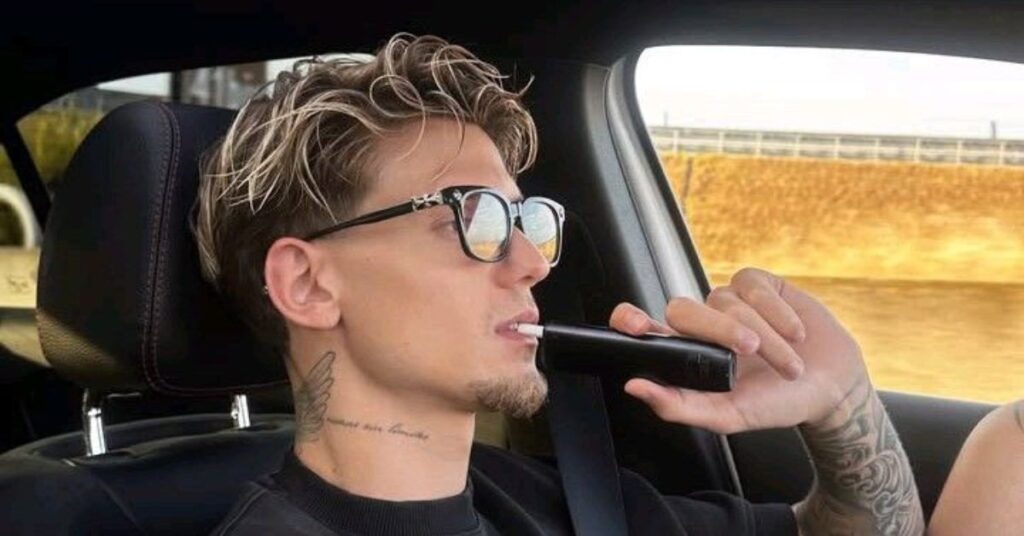 Modern layered mullet haircut for men with edgy textured layers and a tapered finish.