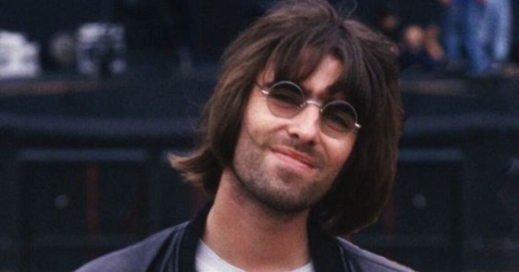 Modern mullet haircut with textured layers on top and long flowing hair at the back.