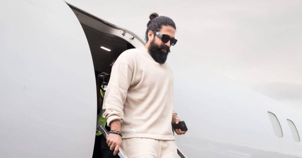 Functional men's top knot or samurai bun with long layered hair and clean undercut.