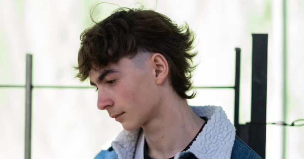 Wavy textured curtain bangs creating a soft face-framing effect.