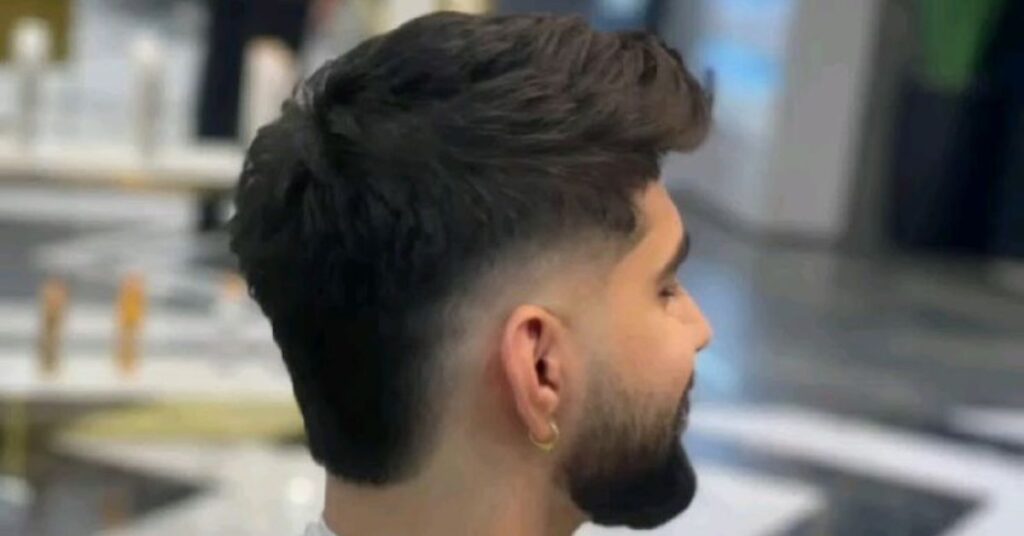 Curly burst fade mohawk with textured top