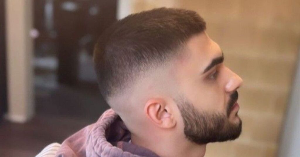 Curly buzz cut with sharp line-up