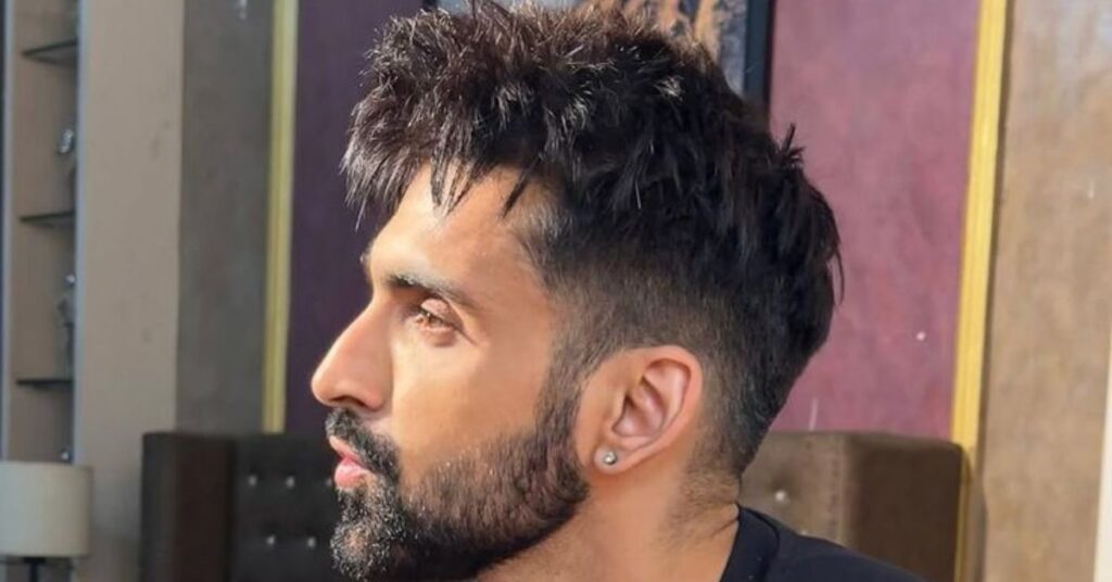 High taper fade for men with curly hair