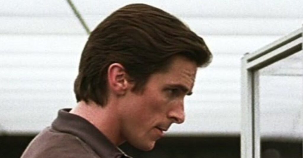 Slick back hairstyle for men with curly hai