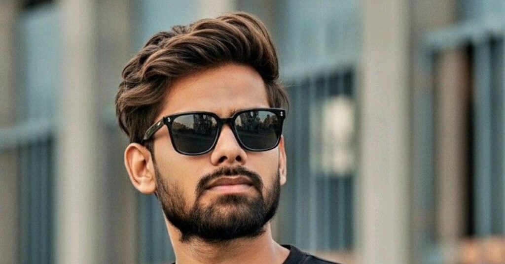 Voluminous curly top with groomed beard for men