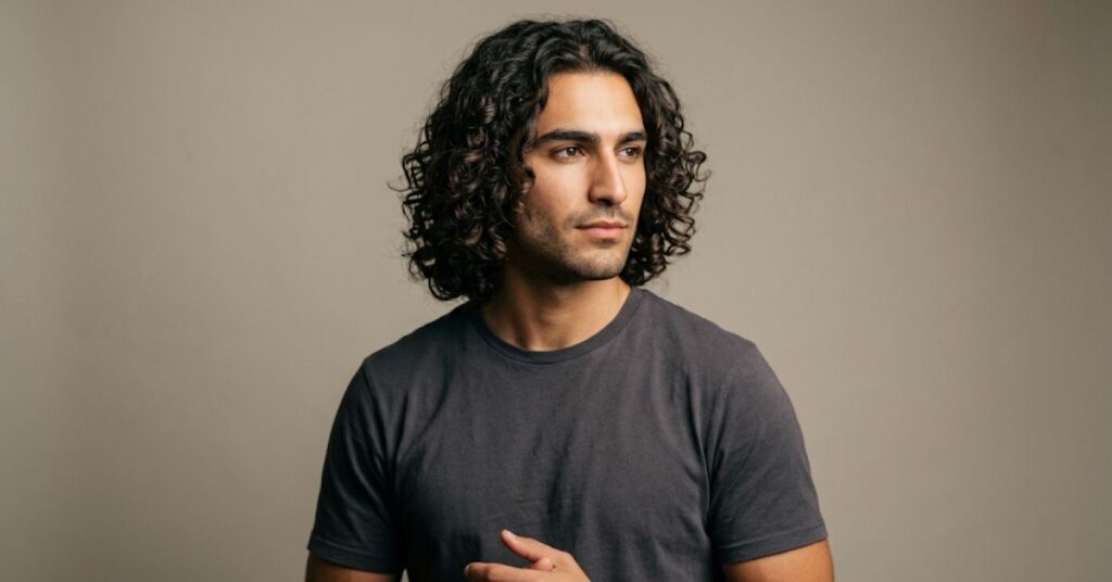 Shoulder length curly hair flow for men