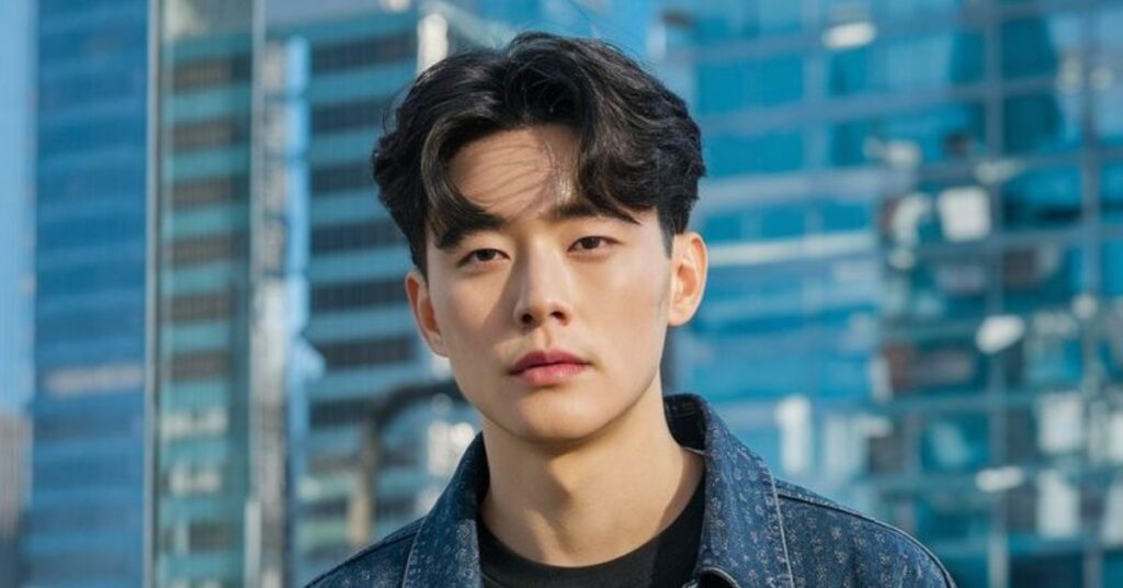 Classic 60-40 side part Korean hairstyle cut with a sleek down perm finish.