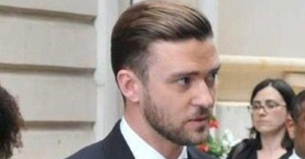 Edgy comb over undercut for men with disconnected sides and high volume top.