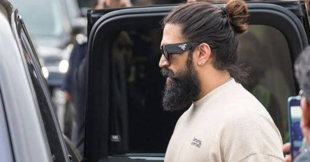 Clean contemporary man bun for men with long straight hair.
