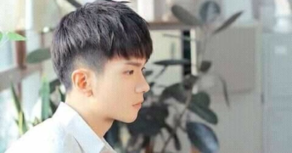 Low Fade Modern Mullet with subtle side blend.