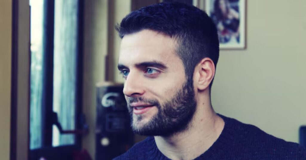 Trendy French crop haircut with blunt fringe and high skin fade.