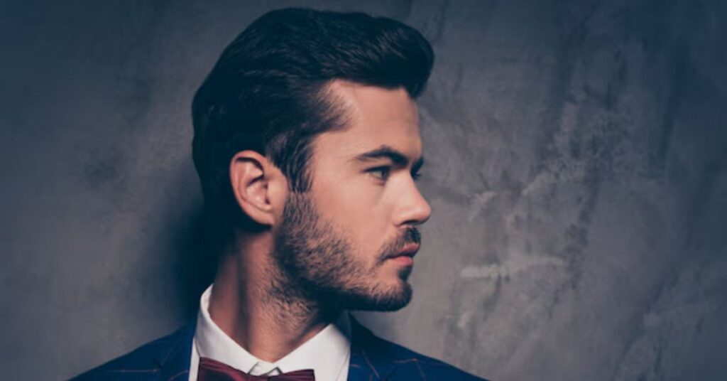 Tall pompadour hairstyle for men with high tapered fade and volume.