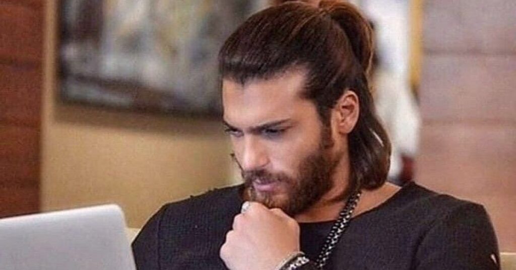 Sleek high ponytail for men with long, healthy straight hair.