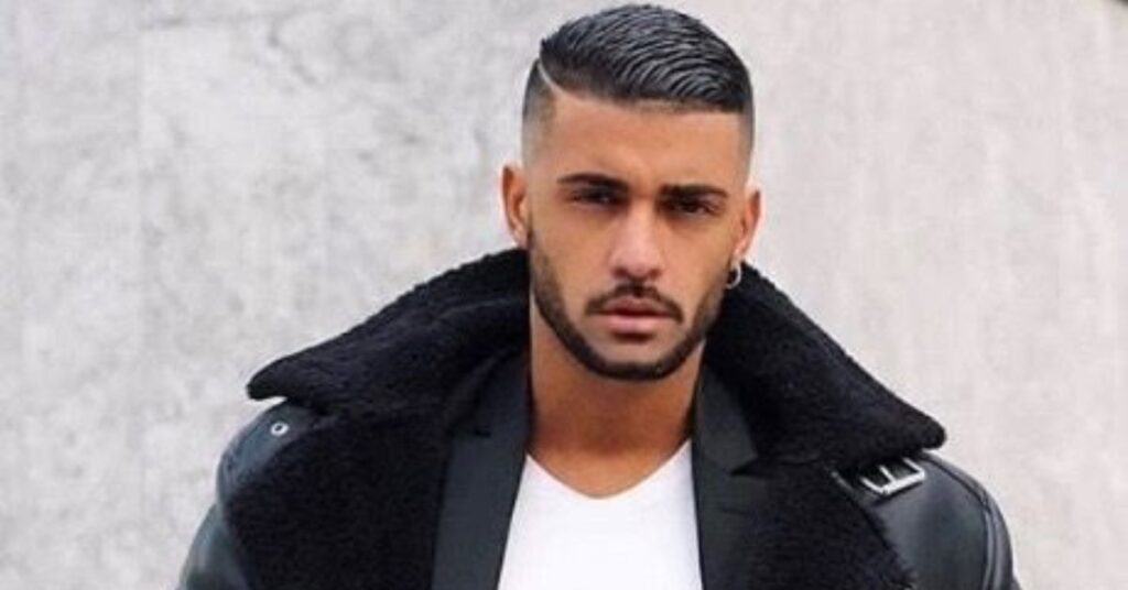 Trending mid fade comb over for men with a defined parting line.