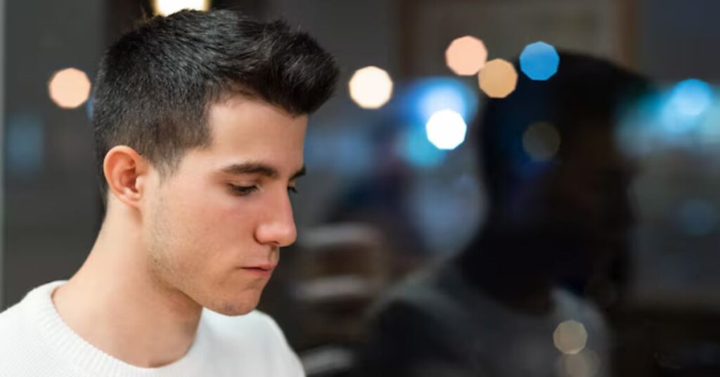 Mid fade comb over featuring a sharp defined side part