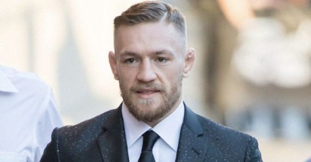 Sharp military comb over fade with ultra-short sides and a clean disciplined top.