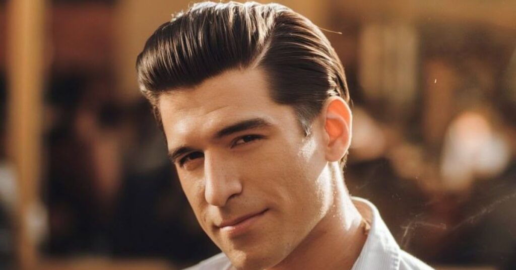 Matte slicked-back hairstyle with volume for men with straight hair.