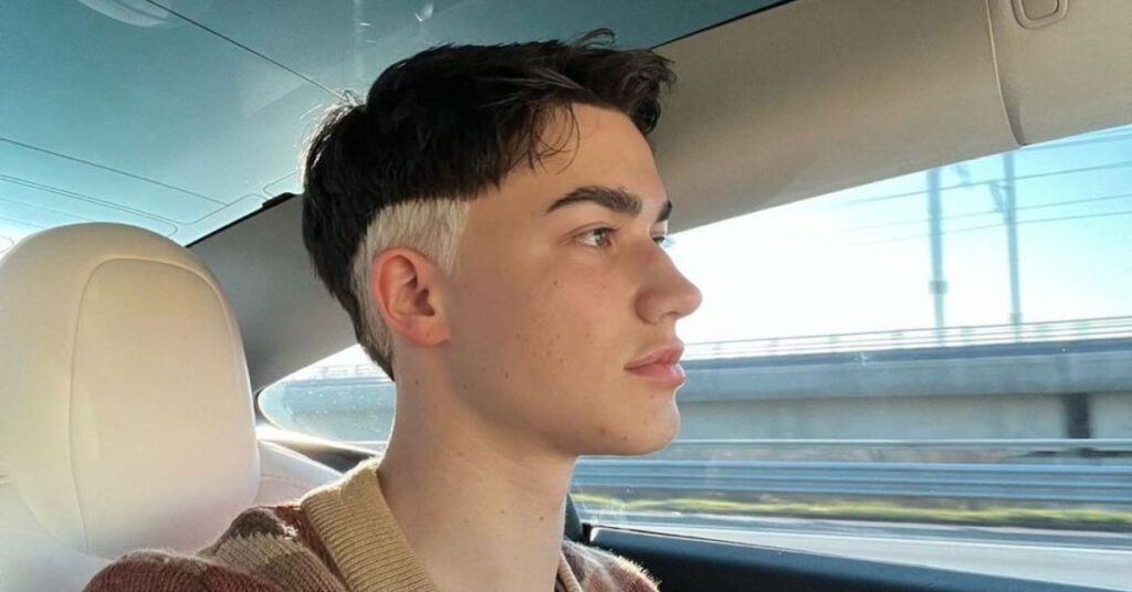 Mullet with dyed blonde tips and textured layers.