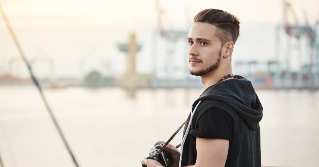 High volume quiff haircut with a disconnected undercut.