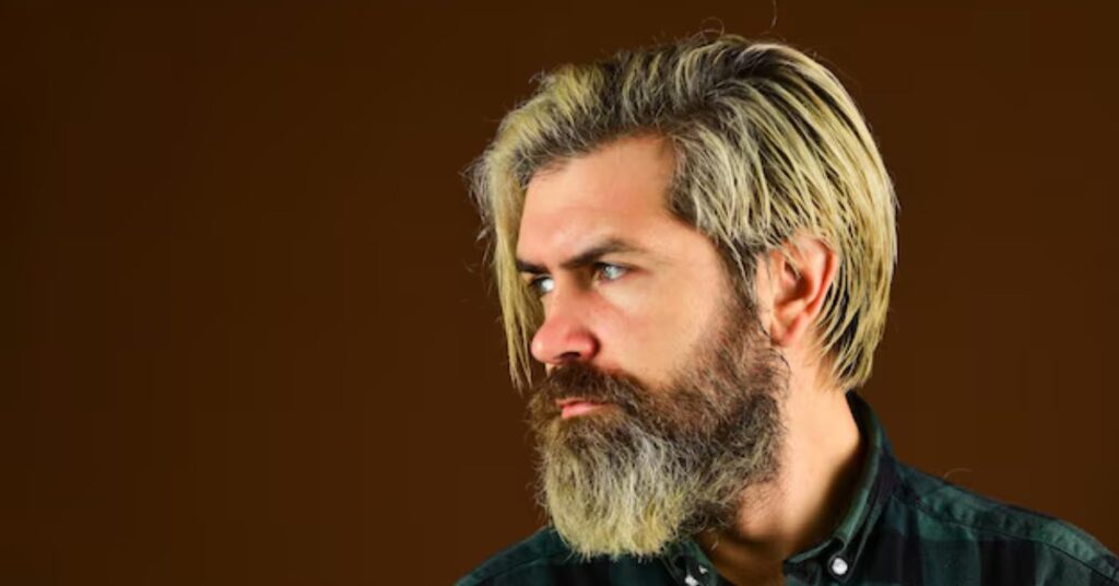 Sophisticated old money style side part with soft taper fade.