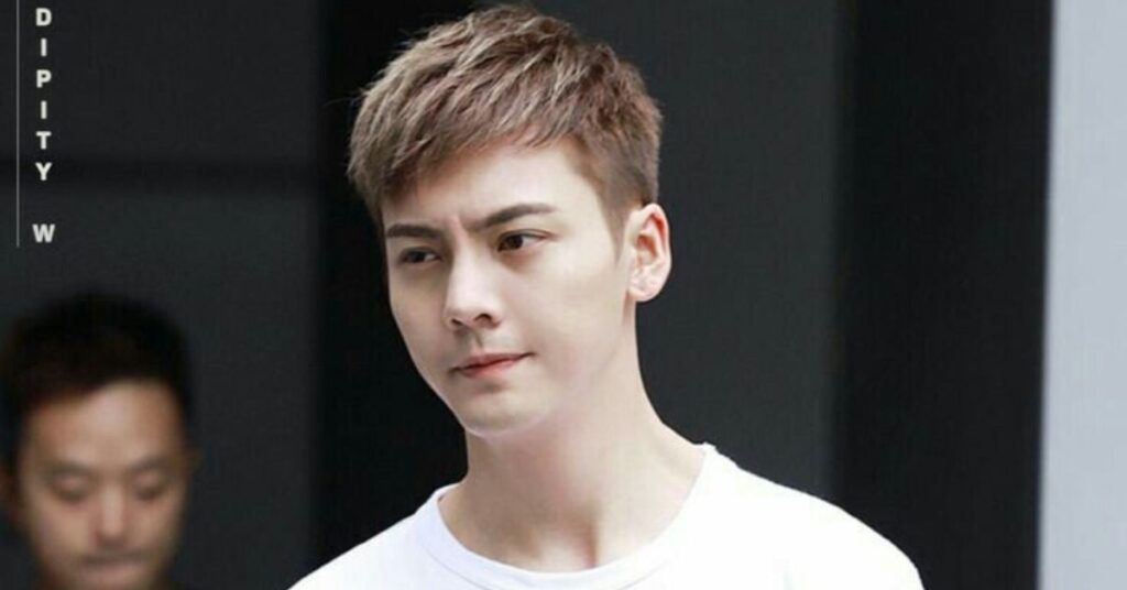 The iconic Comma Korean hairstyle cut with curved bangs for face symmetry.