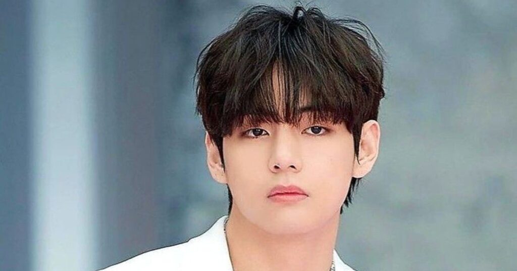 BTS V-inspired Korean hairstyle cut with sharp eye-framing wispy layers.