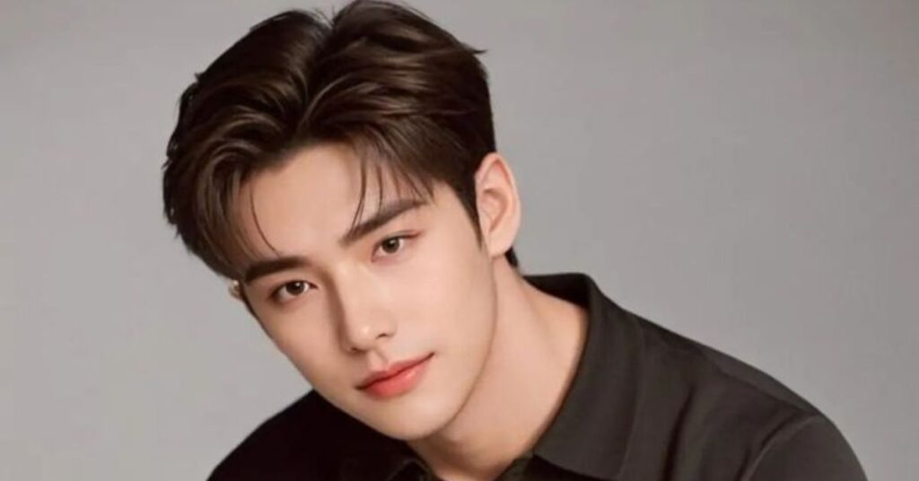 The iconic Comma Korean hairstyle cut with curved bangs for face symmetry.