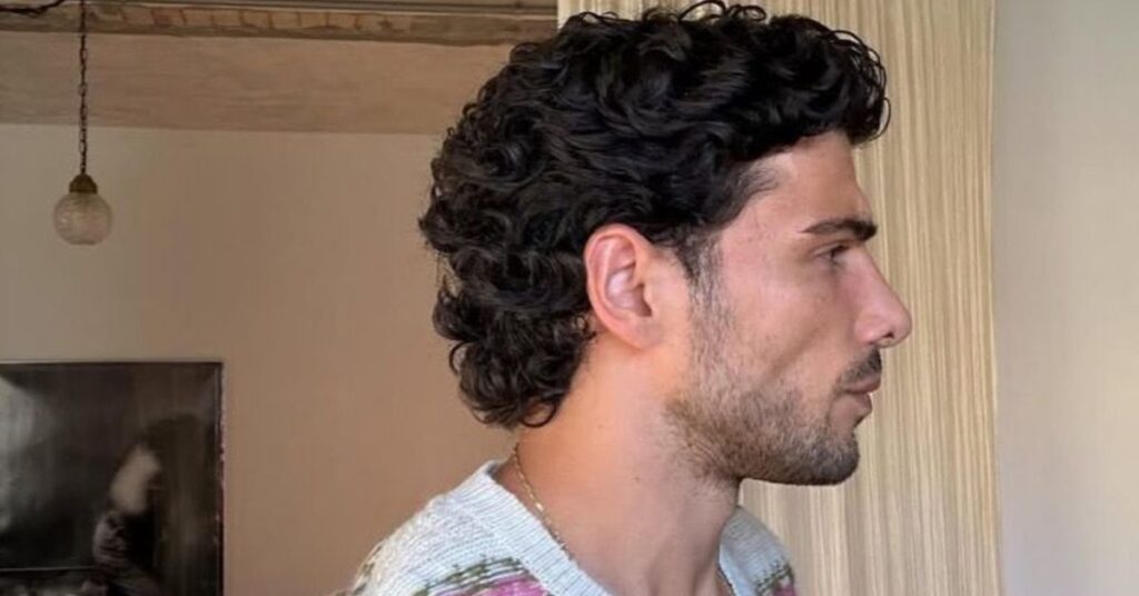 Tapered faux hawk modern mullet haircut.