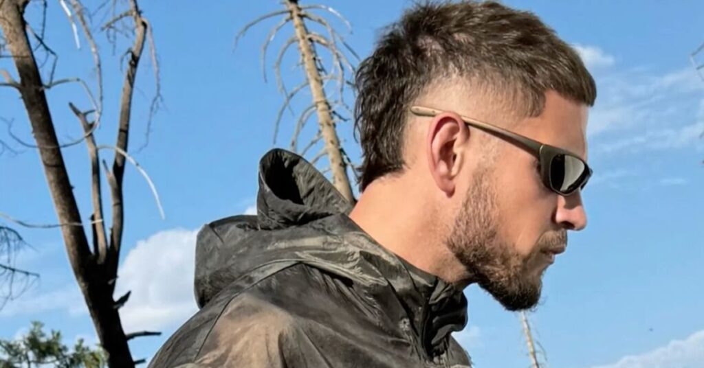 Short modern mullet with shaved sides.