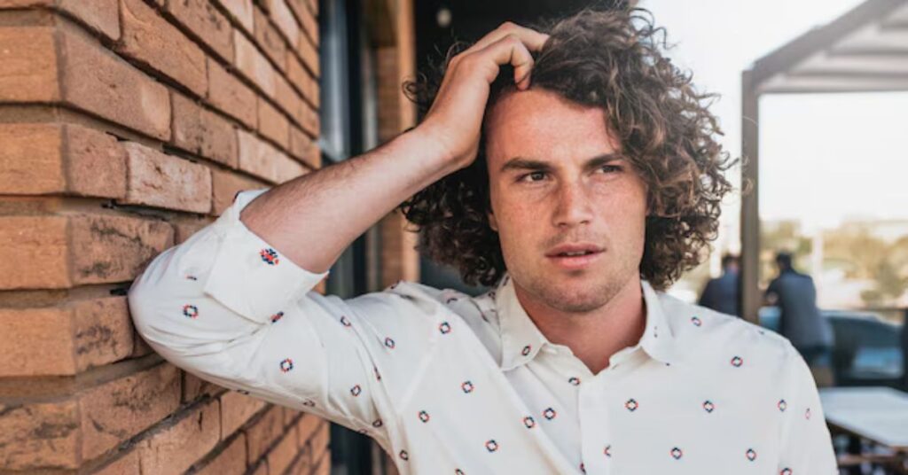 Shoulder-length curly lob balancing natural volume and polished length.