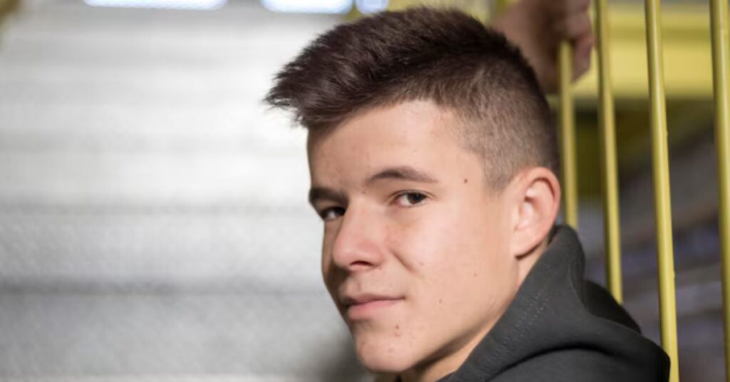 Combined faux hawk and undercut style with high skin-tight fade.